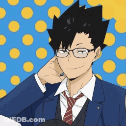 A Man Wearing Glasses And A Suit Is Smiling And Holding His Hand To His Ear GIF