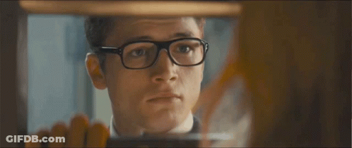 A Man Wearing Glasses And A Suit Says I 'Ll Be Right Back GIF