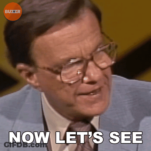 A Man Wearing Glasses And A Suit Says Now Let 'S See GIF