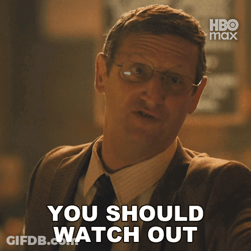 A Man Wearing Glasses And A Suit Says You Should Watch Out GIF