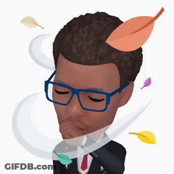 A Man Wearing Glasses And A Suit With Leaves Coming Out Of His Head GIF