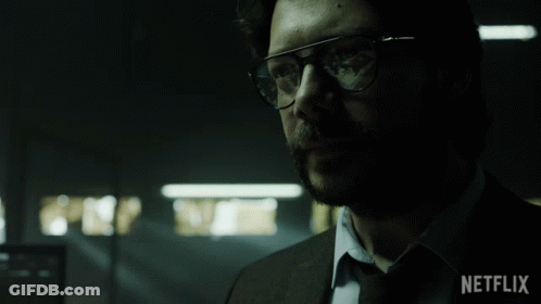 A Man Wearing Glasses And A Suit With Netflix Written On The Bottom Right GIF
