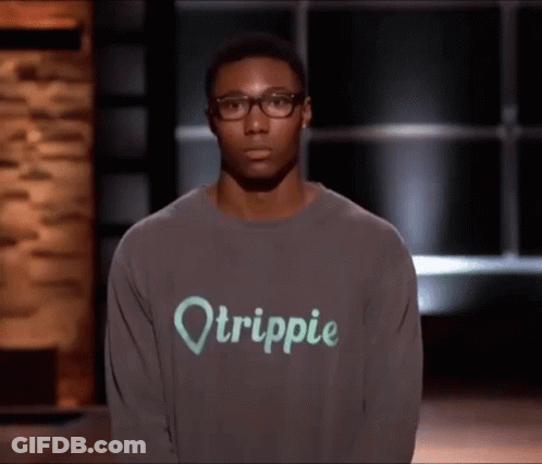 A Man Wearing Glasses And A Sweater That Says Otrippie GIF
