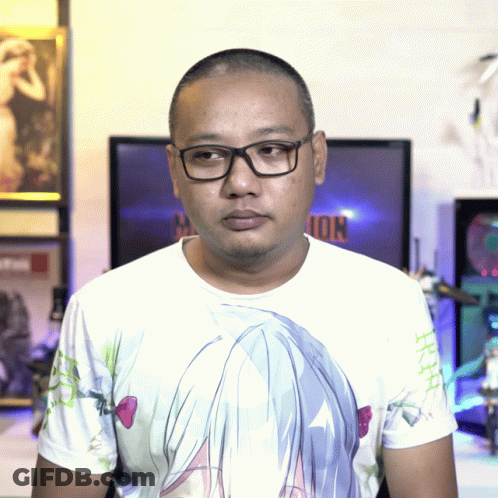 A Man Wearing Glasses And A T-Shirt With A Girl 'S Face On It GIF