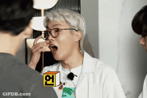 A Man Wearing Glasses And A T-Shirt With A Palm Tree On It Is Making A Funny Face GIF