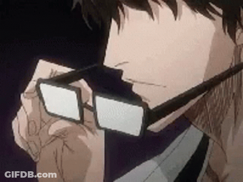 A Man Wearing Glasses And A Tie Is Looking Down At Something . GIF