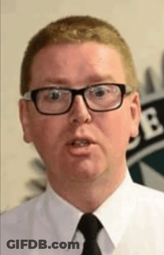 A Man Wearing Glasses And A Tie Is Talking GIF