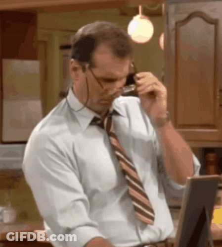 Man With Glasses And Tie Talking On Phone GIF