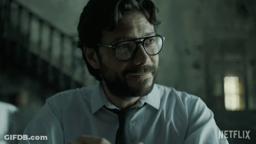 A Man Wearing Glasses And A Tie With The Word Netflix On The Bottom Right GIF