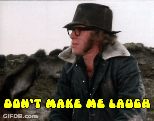 A Man Wearing Glasses And A Top Hat Says " Don 'T Make Me Laugh " GIF