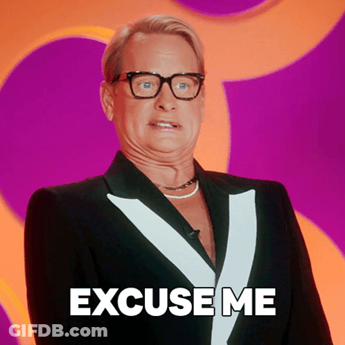 A Man Wearing Glasses And A Tuxedo Says Excuse Me GIF