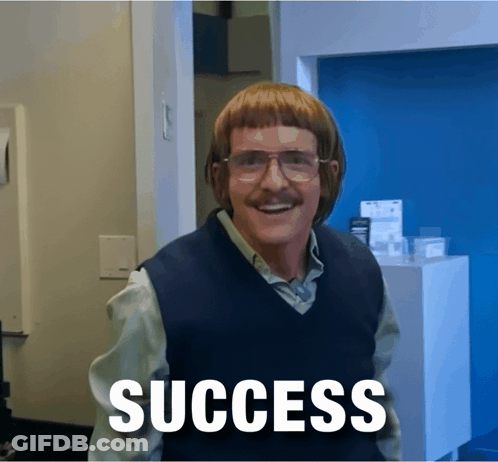 A Man Wearing Glasses And A Vest With The Word Success Written On It GIF