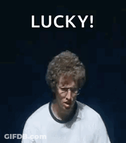 A Man Wearing Glasses And A Watch Is Making A Funny Face And Holding His Hands Up In The Air . GIF