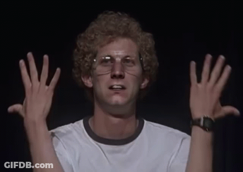 A Man Wearing Glasses And A White Shirt Has His Hands Up GIF
