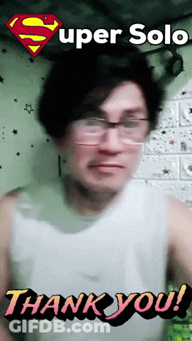 A Man Wearing Glasses And A White Tank Top Says " Thank You " GIF