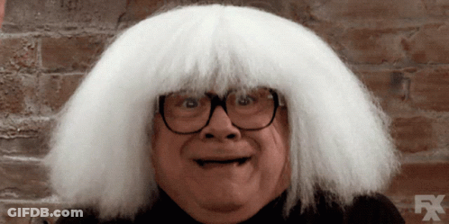A Man Wearing Glasses And A White Wig With Fx On The Bottom GIF