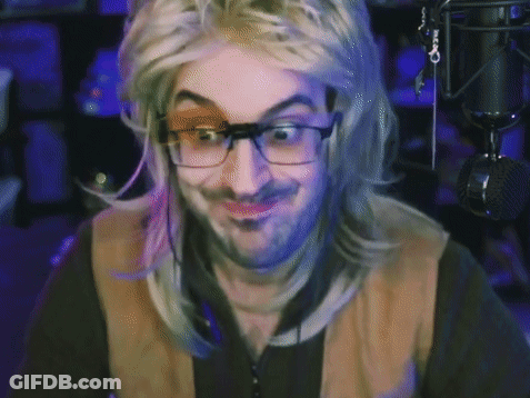 A Man Wearing Glasses And A Wig Is Giving A Thumbs Up Sign GIF