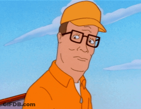 A Man Wearing Glasses And A Yellow Hat Is Looking Down GIF