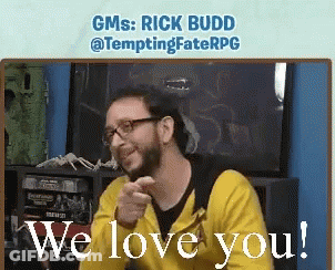 A Man Wearing Glasses And A Yellow Hoodie Says We Love You GIF