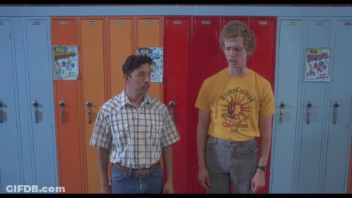 A Man Wearing Glasses And A Yellow Shirt That Says ' Ricks College ' GIF