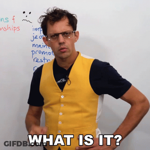 A Man Wearing Glasses And A Yellow Vest Asks What Is It GIF