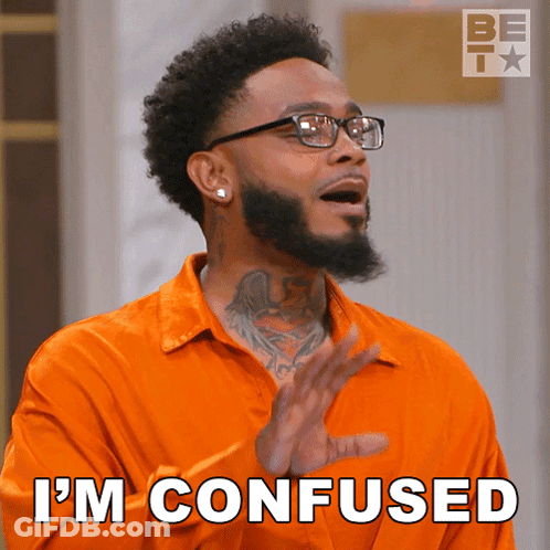 A Man Wearing Glasses And An Orange Shirt Says " I 'M Confused " GIF