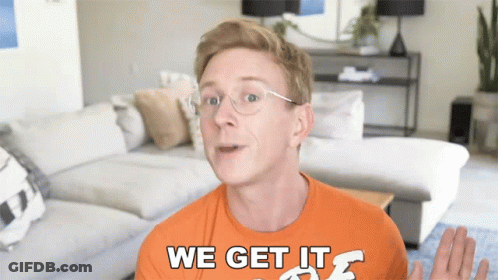 A Man Wearing Glasses And An Orange Shirt That Says We Get It GIF