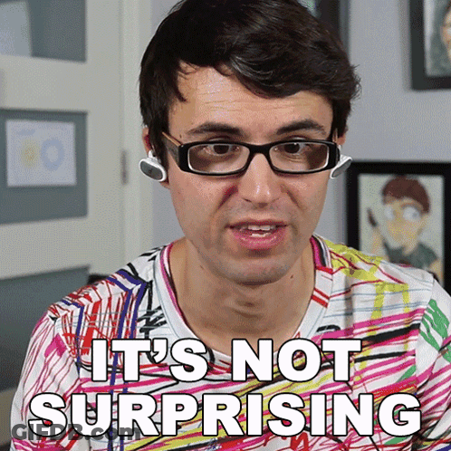 A Man Wearing Glasses And Ear Buds Says It 'S Not Surprising GIF