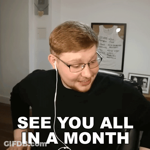 A Man Wearing Glasses And Earbuds Says See You All In A Month GIF