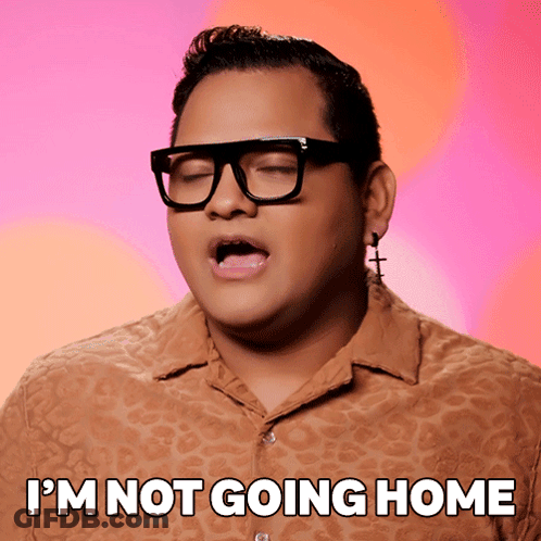 A Man Wearing Glasses And Earrings With The Words I 'M Not Going Home Below Him GIF