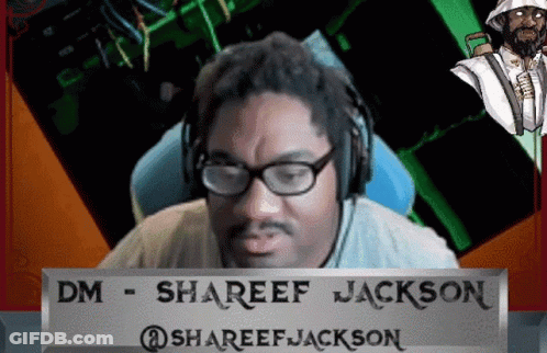 A Man Wearing Glasses And Headphones Behind A Sign That Says Shareef Jackson GIF