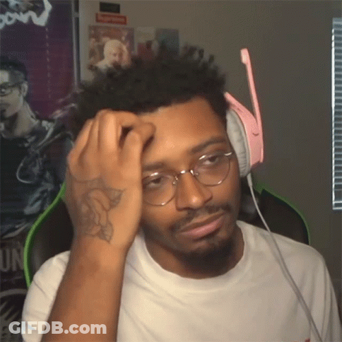 A Man Wearing Glasses And Headphones Has A Tattoo On His Arm GIF