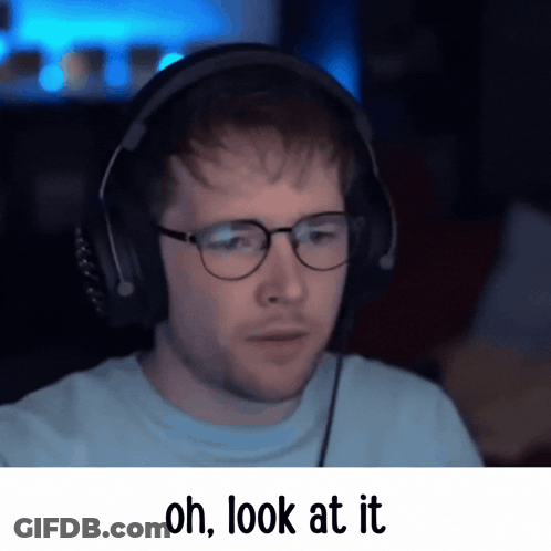 A Man Wearing Glasses And Headphones Has The Words Oh Look At It Below Him GIF