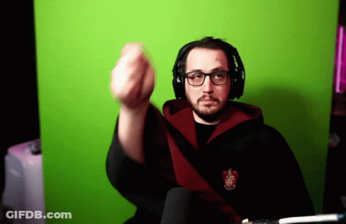 A Man Wearing Glasses And Headphones Is Giving The Middle Finger In Front Of A Green Background GIF