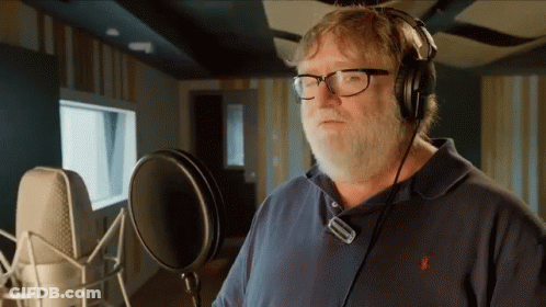 A Man Wearing Glasses And Headphones Is Singing Into A Microphone . GIF