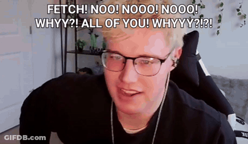 A Man Wearing Glasses And Headphones Is Sitting In A Chair And Talking To The Camera . GIF