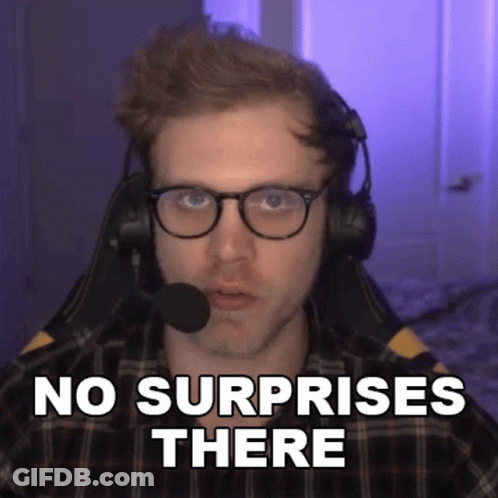 A Man Wearing Glasses And Headphones Is Sitting In Front Of A Microphone And Says No Surprises There . GIF