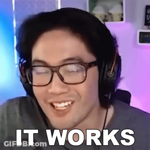 A Man Wearing Glasses And Headphones Is Smiling With The Words It Works Behind Him GIF