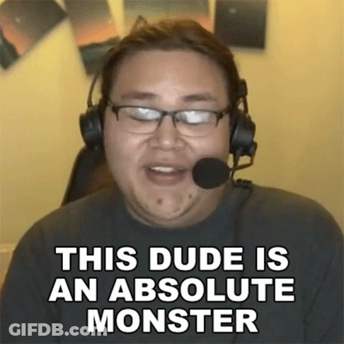 A Man Wearing Glasses And Headphones Is Talking Into A Microphone . GIF
