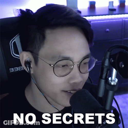 A Man Wearing Glasses And Headphones Is Talking Into A Microphone With The Words No Secrets Below Him GIF
