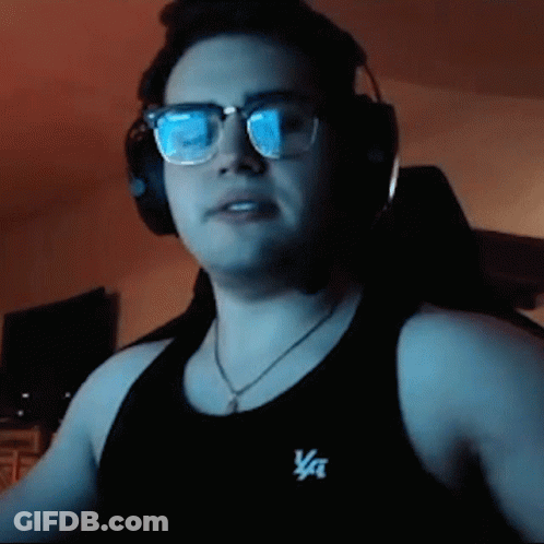 A Man Wearing Glasses And Headphones Is Wearing A Black Tank Top That Says Va On It GIF