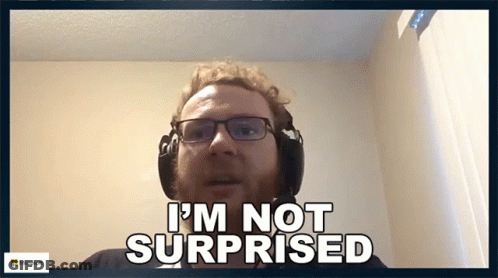 A Man Wearing Glasses And Headphones Says " I 'M Not Surprised " GIF