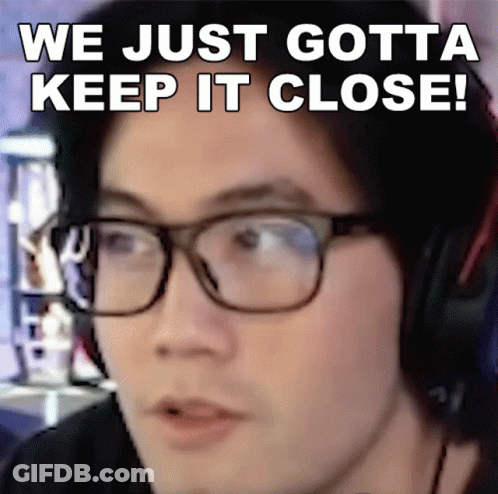 A Man Wearing Glasses And Headphones With The Words We Just Gotta Keep It Close Above Him GIF
