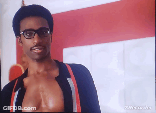 A Man Wearing Glasses And Suspenders Is On A Tv Screen With Xrecorder Written On The Bottom GIF