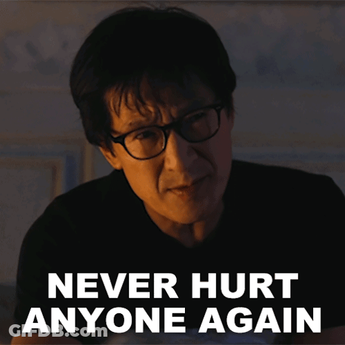 A Man Wearing Glasses Has The Words Never Hurt Anyone Again Above His Head GIF