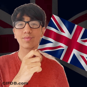 A Man Wearing Glasses Holds A British Flag In Front Of A British Flag GIF