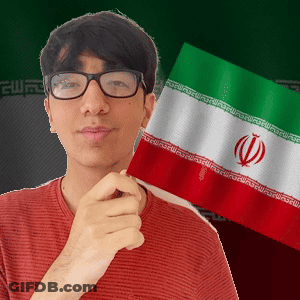 A Man Wearing Glasses Holds A Flag In Front Of Him GIF