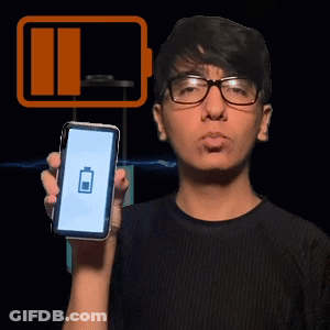 A Man Wearing Glasses Holds Up A Cell Phone With A Battery Icon On The Screen GIF
