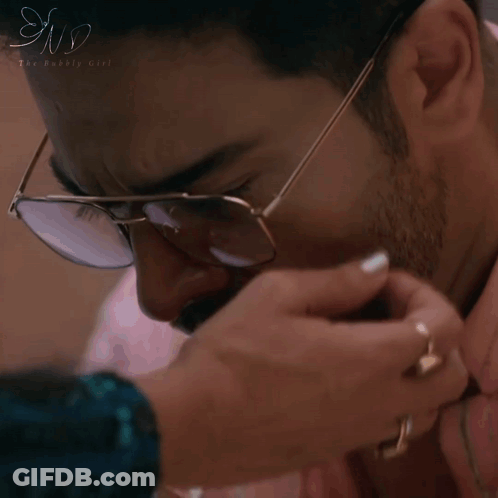 A Man Wearing Glasses Is Being Touched By A Woman 'S Hand And The Words Look At Me Are On The Bottom GIF