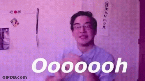 A Man Wearing Glasses Is Clapping His Hands In Front Of A Purple Wall And Says Oooooooh . GIF
